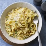 Creamy Butternut Squash Pasta Sauce with Parmesan Cheese and Fresh Herbs.